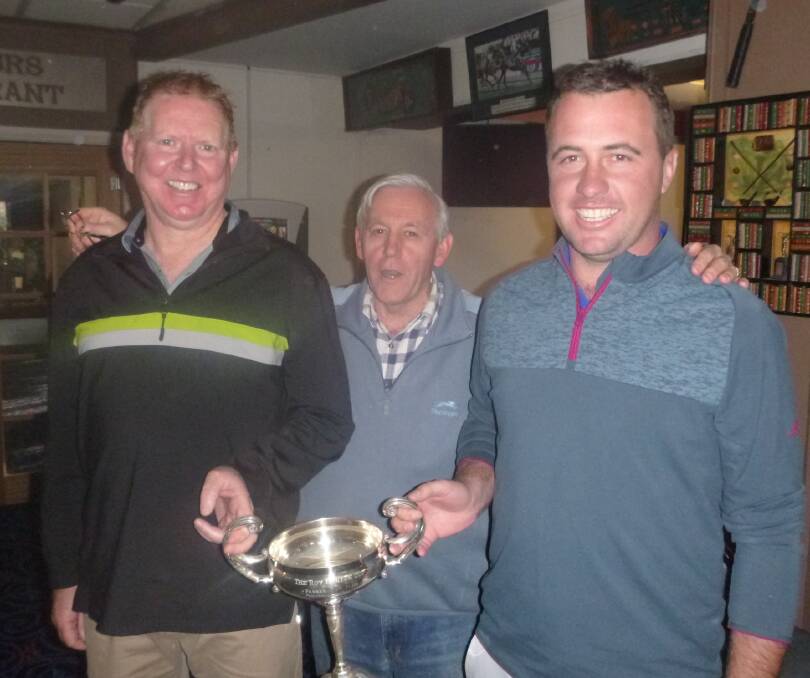  Foursome Scratch Winners: Peter Dawson and Dan Bayley holding the trophy and being congratulated by Club Captain Steve Grallelis.