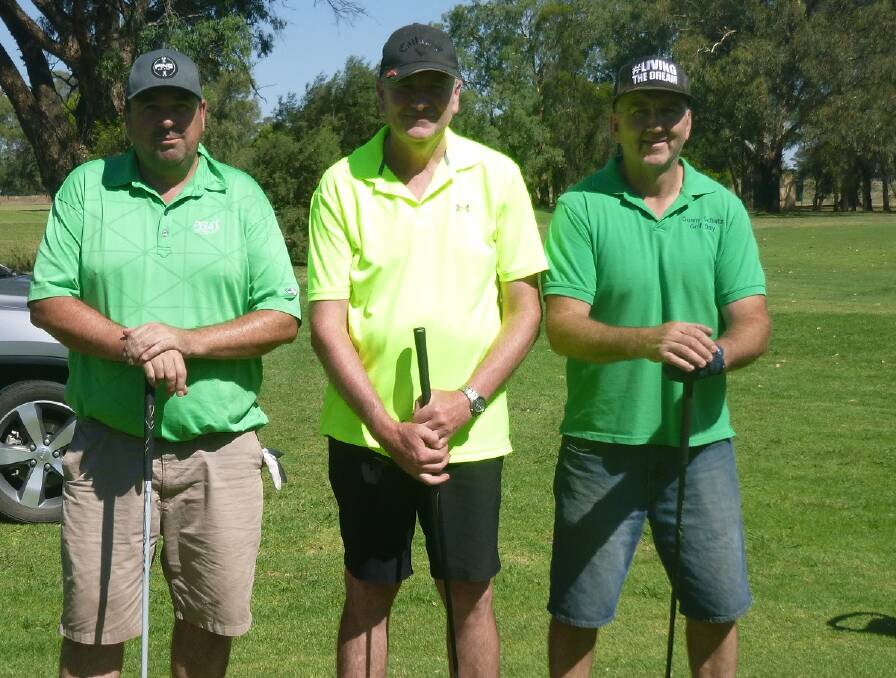 Tee off for 2017: Mike Spice, Phil Maher, Marty Cahill – preparing at the 15th tee. They were very careful to arrange themselves in a coordinated colour combination!