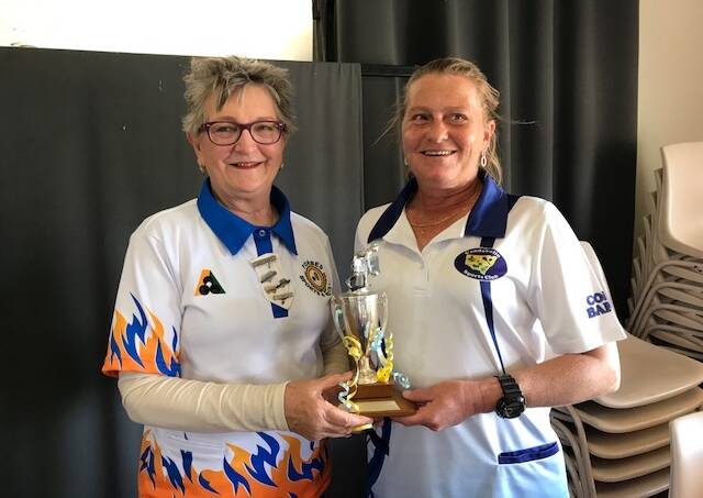 Well Done: Judy Girot (L) presenting the cannon Merritt Trophy to Judy Dodgson from Condobolin.