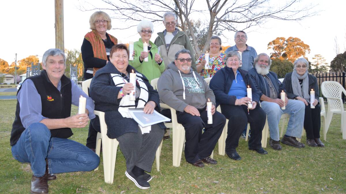 A candlelight vigil was held at Bushman's Dam on Sunday. Back from left - Sandi Bailey, Toni and Alan Affleck, Bob Gill and Tara Mann; Geoff Anderson, Liesel Walters, Ross Bailey, Di Gill, Kevin Dumesny, and Evelyn Shallvey. Photo by Barbara Watt. 