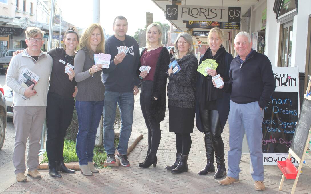 Forbes business owners are thrilled with the success of the Why Leave Town gift card program with $142,582 being loaded onto cards in Forbes since October 2013. Pictured is Brian Gunn, Gabe McMillan, Janet Callaghan, Martin Cahill, Katie Grace, Marg Duggan, Kim Sly and Greg Gunn with the Why Leave Town gift cards.
