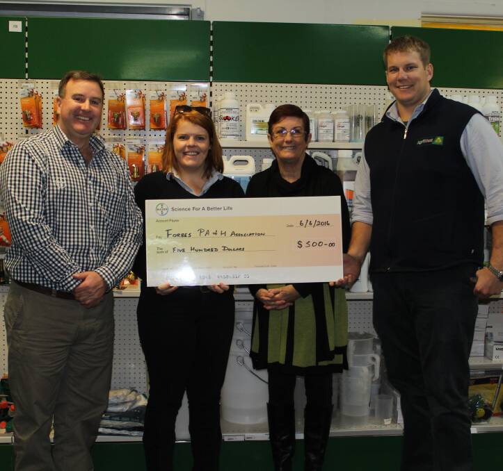 Forbes PA and H Association president Jan Facey (second from right) accepts a cheque from Bayer's Jon Bennett and Agriwest CRT Forbes' Em Wollen and Brett Rout.