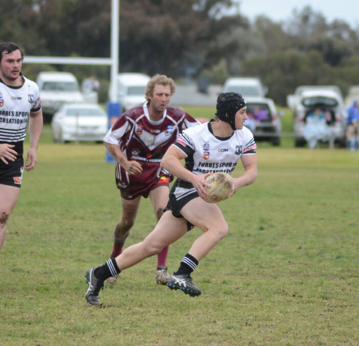 Hayden Bolam on the run for the Forbes Magpies.