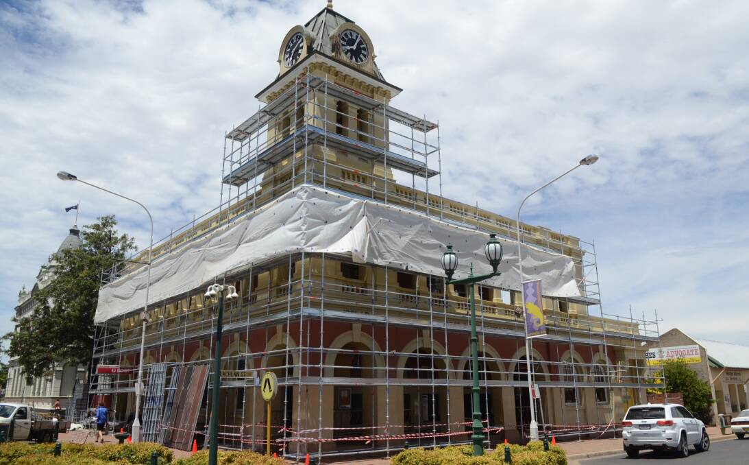 Scaffolding going up around the Post Office in preparation for a new coat of paint.