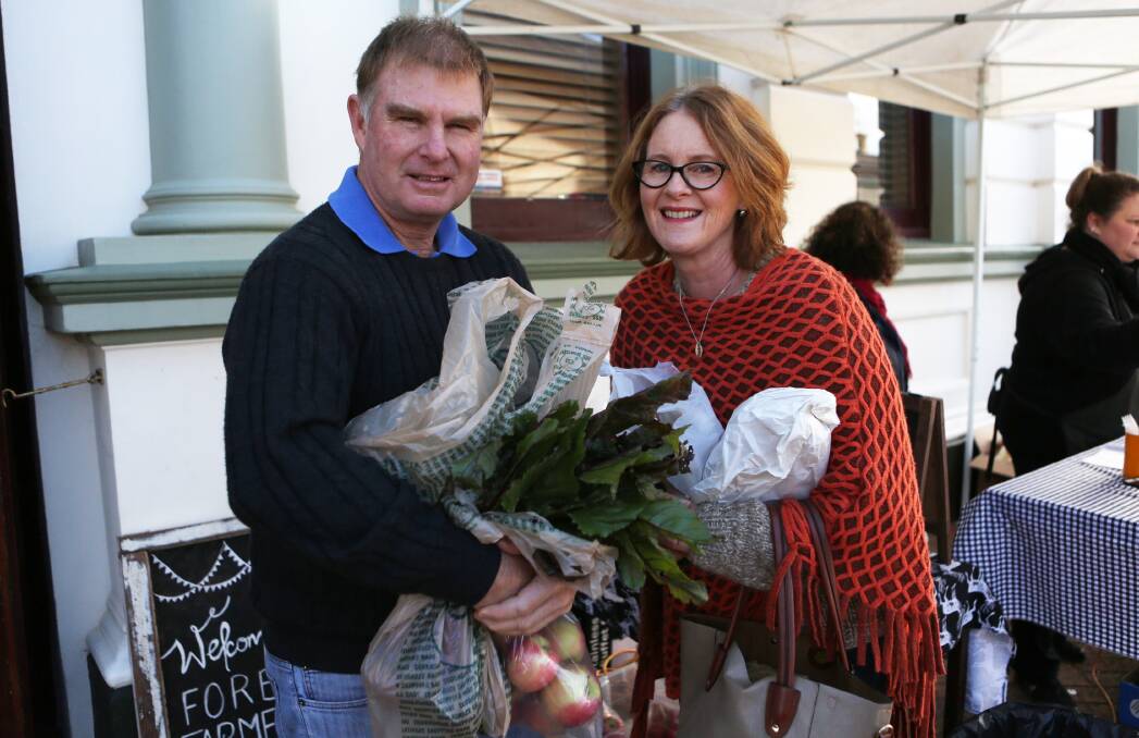 Glenn and Donna Pavey with some fresh produce at a recent Forbes Farmers' Market. The markets, on this Saturday, need more volunteers to continue.