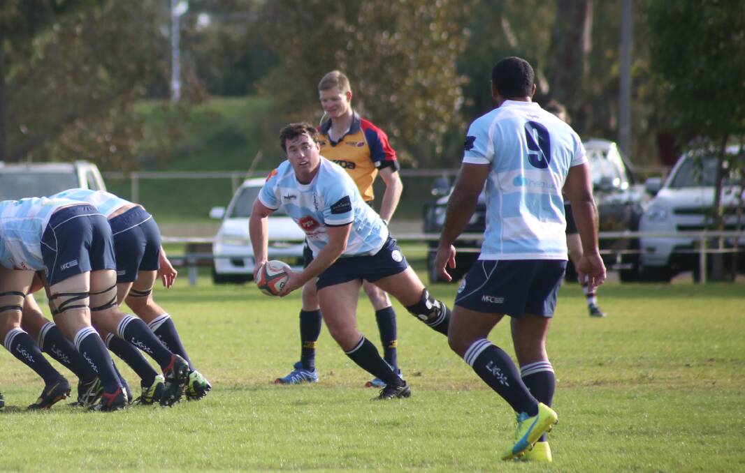 Simon Flynn gets the ball out for the Platypi in last weekend's home game. 