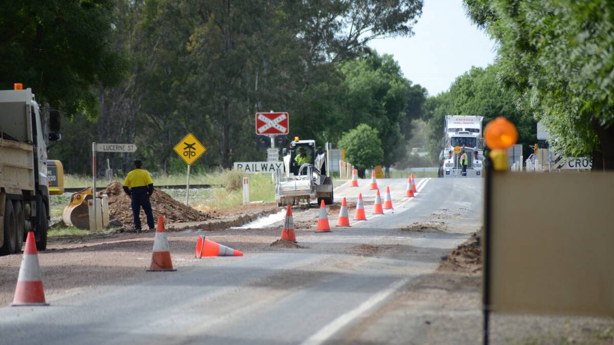 Road works on the Cowra Road just past the Iron Bridge yesterday. Council urges people to drive to conditions as many local roads are flood damaged.