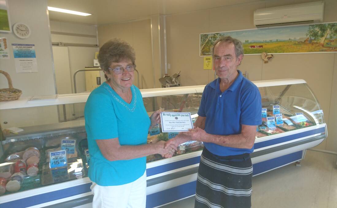 Elaine Bright presenting a Certificate of Appreciation to Ron Kenny of Baa Moo Oink Butchery.