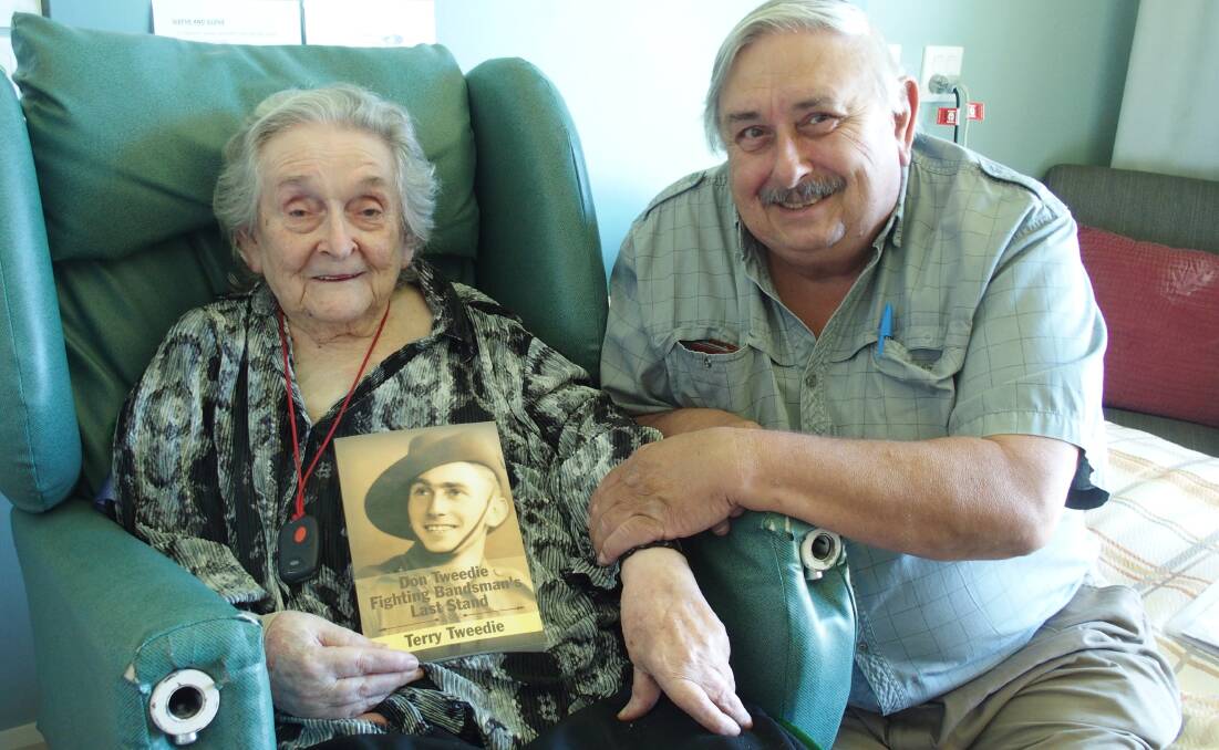 Terry Tweedie presents a copy of his father's biography to mum Theo at JRV. 
