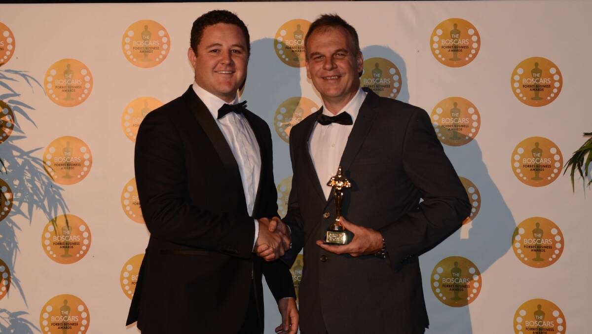 Steve Walker from Walkers AGnVET congratulates Steven Morrison from HE Silos on winning the Boscar for Excellence in Business Innovation in 2016.