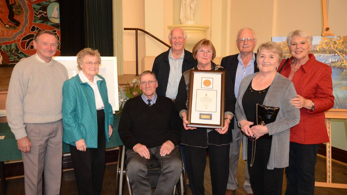Last year's Medal winner Forbes and District Historical Society members Ray and Liz New, Alister Lockhart, Don Rath, Susan Stewart, Bruce and Margaret Adams and Margaret Messenger (front) with the Forbes Medal. 