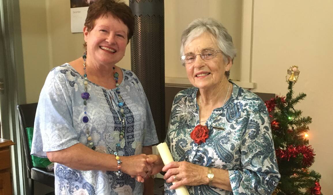 New Bogan Gate CWA President Marion McIntyre presenting Margaret O’Connell with her Long Service Bar.
