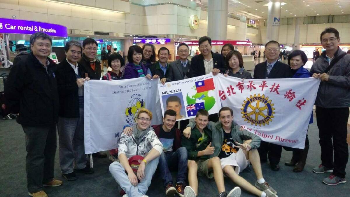 Mitch Ashcroft with the four Taipei host families he lived with across the year.