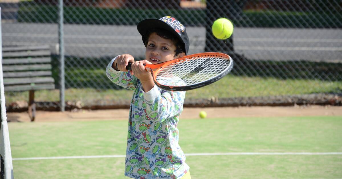 KIDS ON THE COURT: School kids aged five to fifteen took to the courts before Easter for a tennis coaching clinic.