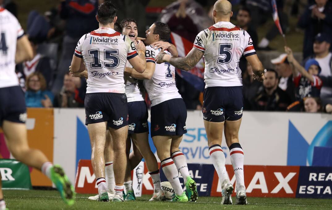 SUPER SUB: Dubbo product Connor Watson (centre) delivered when he was selected on Sunday, starring with a double in the Roosters' win over the Wests Tigers. Photo: GETTY IMAGES