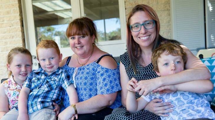 Dionne Barton (left), with Lawrence, 5, and Georgia, 7, and Claire Ormiston, with Samuel, 4, have concerns about Kids Academy Hornsby. Photo: Edwina Pickles