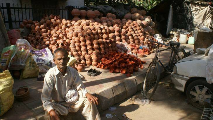 Pottery vendor Ram Kumar waits for customers ahead of the Dwali festival. Photo: Amrit Dhillon