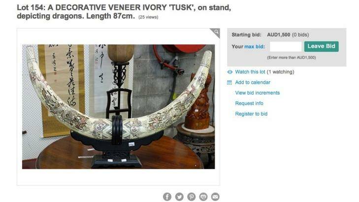 Decorative ivory tusks on an online auction catalogue.