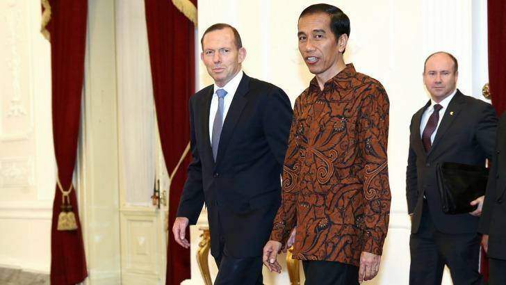Indonesian President Joko Widodo (right) meets Australian Prime Minister Tony Abbott prior to a meeting at the Presidential Palace in Jakarta. Photo: Alex Ellinghausen