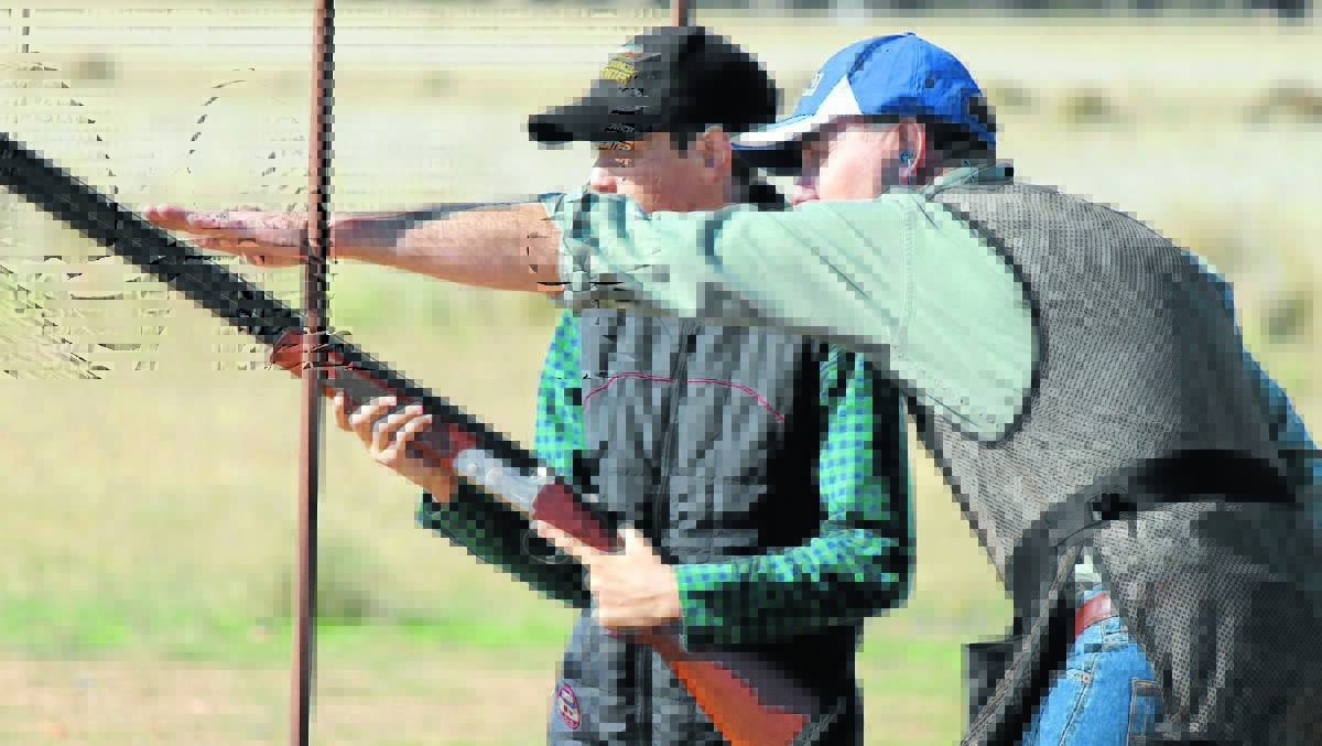 Thirteen-year-old Cameron Smith being taught clay target shooting. Gun Club 238