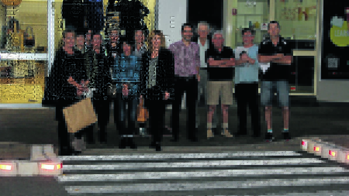 Rankin Street business owners at the pedestrian crossing on Wednesday night.