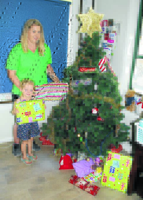 Bright Beginnings teacher Katie Spence and Rubie Hall are encouraging people to put a present under their wishing tree for the children at Forbes Women’s Refuge. 1115wishingtree