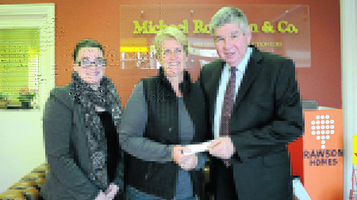 Cara Pocock and Michael Robinson were delighted to present Jennifer Horan (centre) from Forbes Auto Sports Club with $1000 to kick-start the group’s fundraising efforts after their club was cleaned out by thieves and racing was put on hold indefinitely. 0616robinsons4