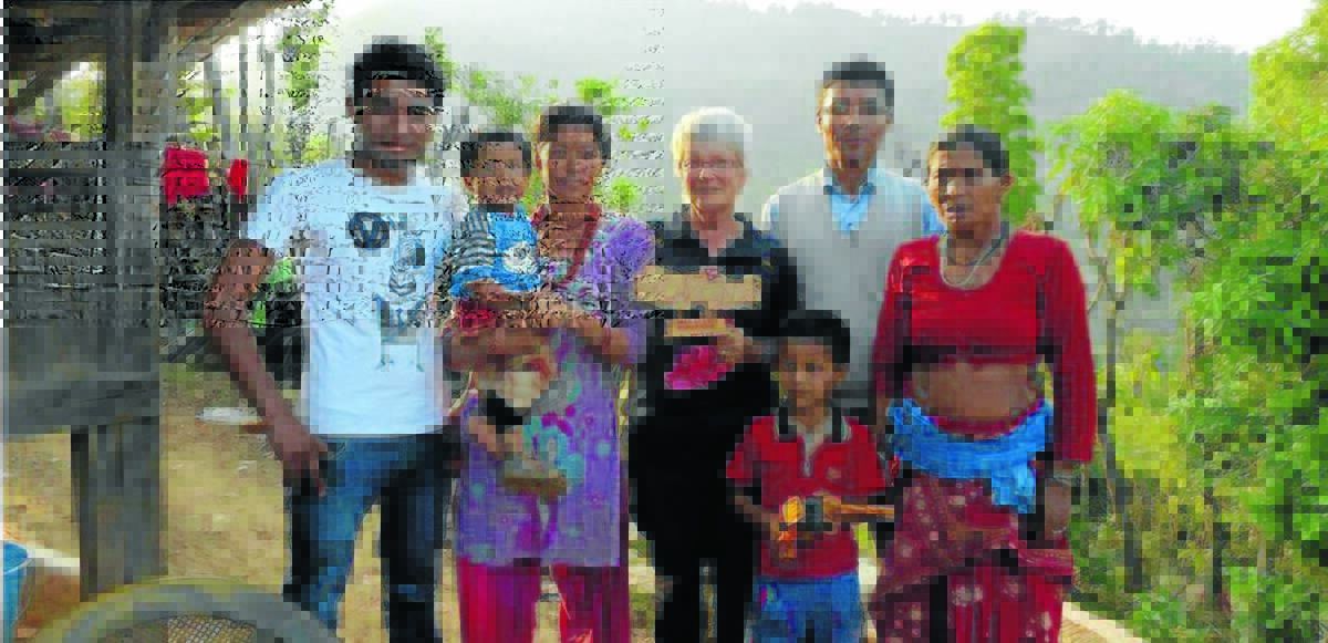 Mary Brell of Orange (centre) with Nepalese teacher Buddhiman Shrestha (second right) and his family in Nepal five days before the earthquake hit last month. 