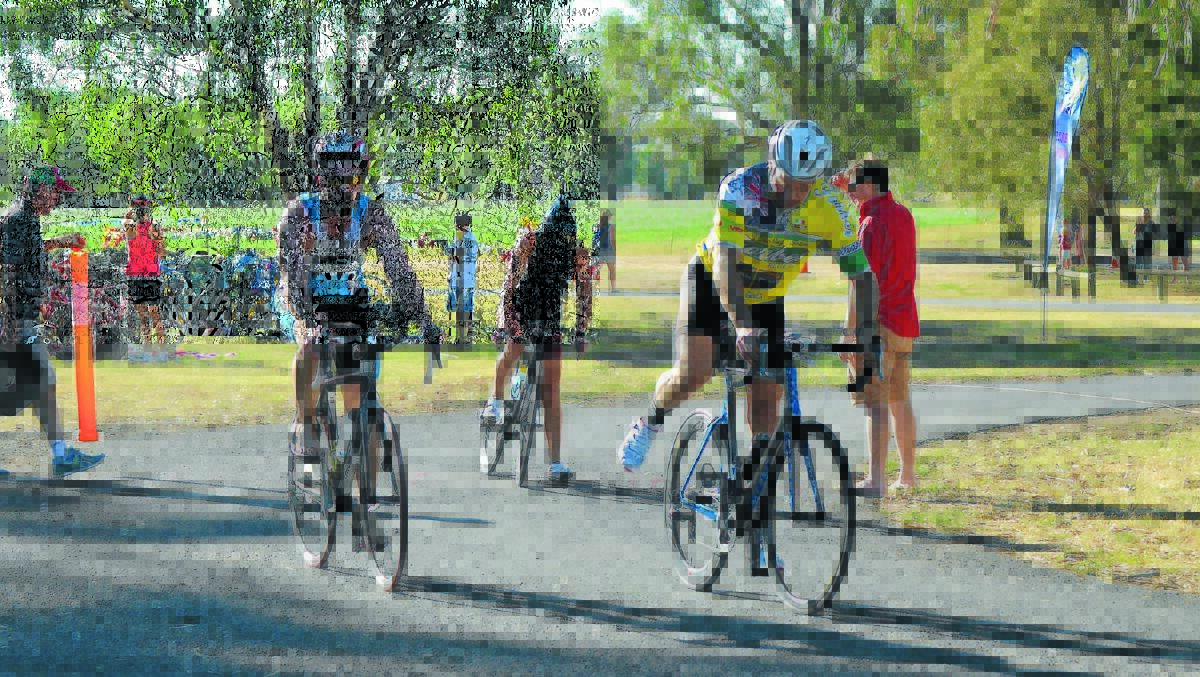 Competitors mount take off on the bike leg at last year's triathlon.