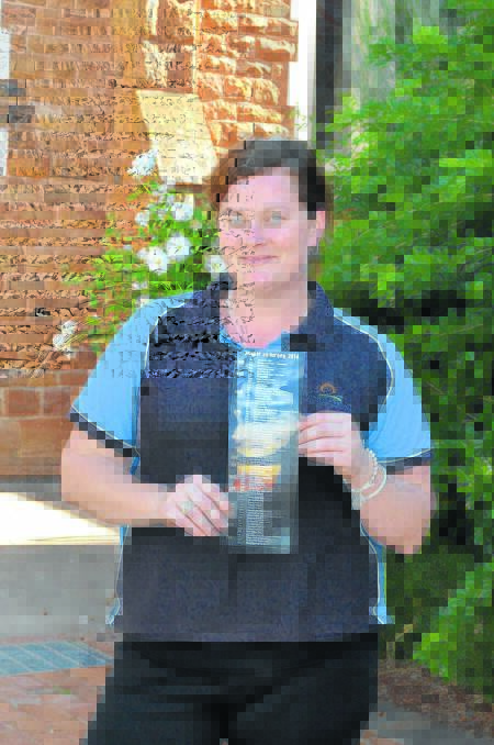 Forbes Shire Council’s marketing manager Sarah White with the fridge magnet of local events on throughout the year. 0414fridgemagnet