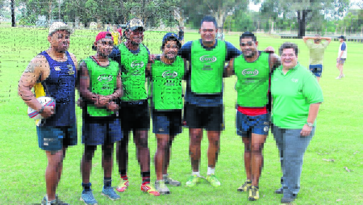 Forbes Platypi first grade coach Heamani Lavaka (left) and Forbes Rugby Union Club president Tracey Prior (right) with the new recruits, Nathan Langilangi, Masi Seru, Mahe Fangupo, Tohi Nusipepa and Hal Honemau. 0316newrecruits(1)