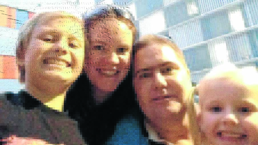 Alysha Heywood and Jason Kidman with their children Joshua and Alana.