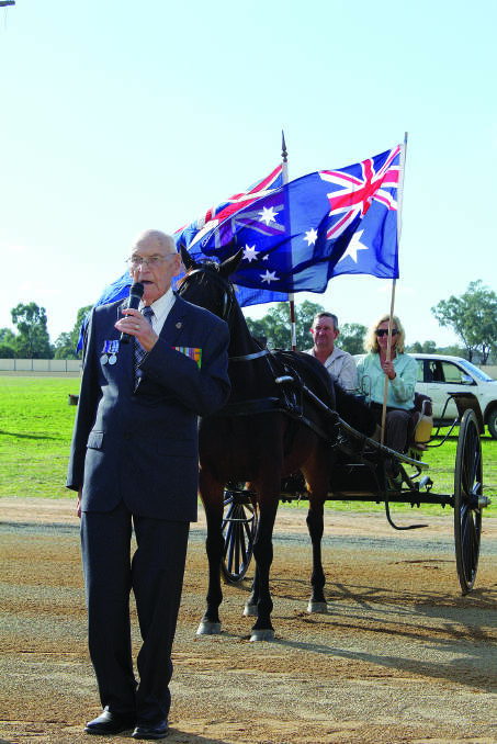 Harry Coggan lead the crowd in a minute’s silence on the race track to mark Anzac Day at last year’s harness racing meeting. 0414harnessracings(36)