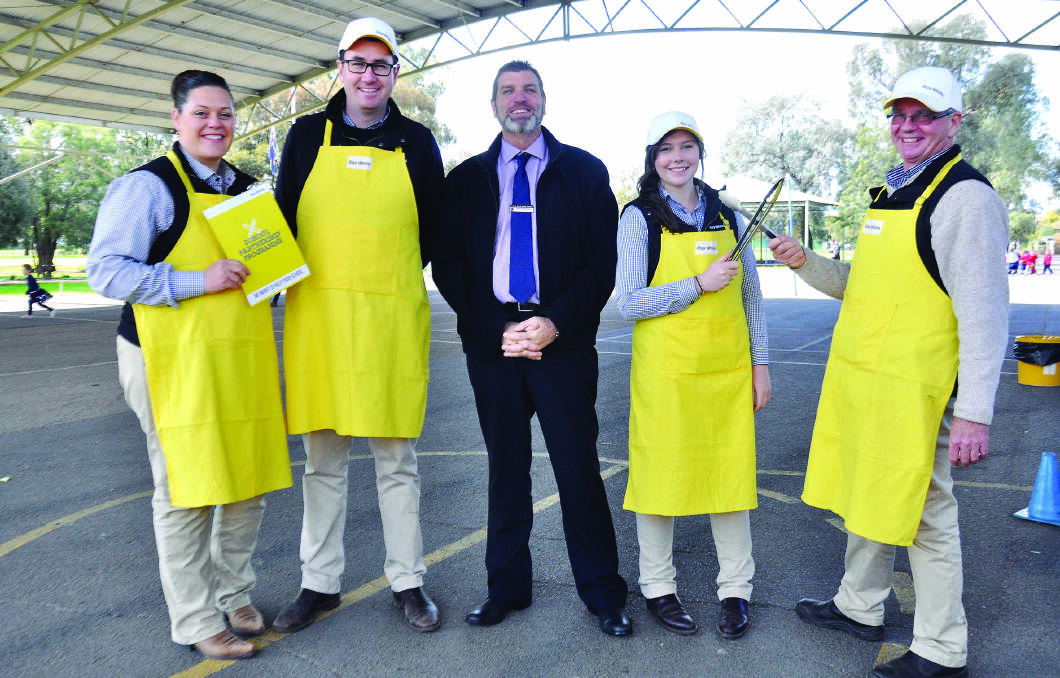 Forbes North Public School Steve McAlister (centre) with the team at Ray White Rural Lisa Glasson, Ian Simpson, Stacey Clarke and Ned Hamilton.