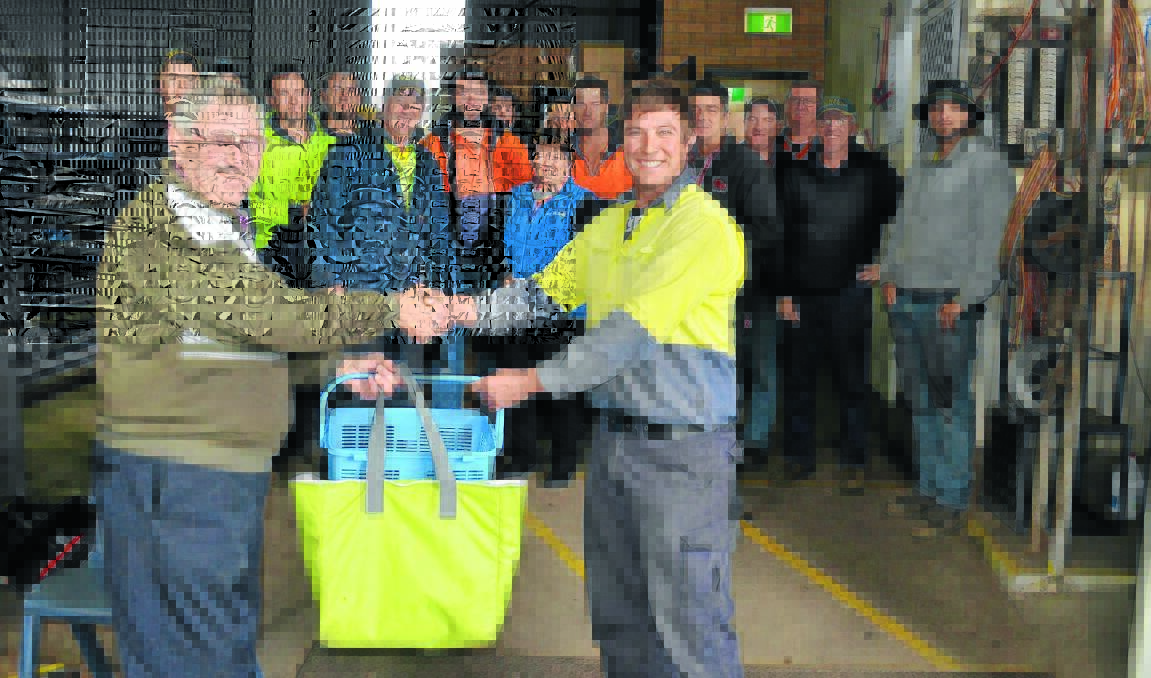 Bob Rodgers (left) is thanked by Duncan Steel’s Adam Sinclair yesterday with staff looking on. Roberty Bob’s has delivered to the Union Street business for 10 years.