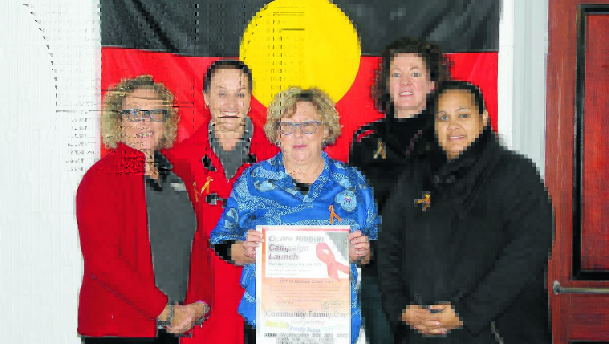 The team at Binaal Billa and Yoorana Gunya are hosting a community day next week to launch the Ochre Ribbon Campaign in support of Aboriginal survivors of domestic and family violence. Pictured is Dee Anderson, Michelle Kable, Donna Bliss, M Dempsey and Kelly Bowden. 0615ochreribbon(1)