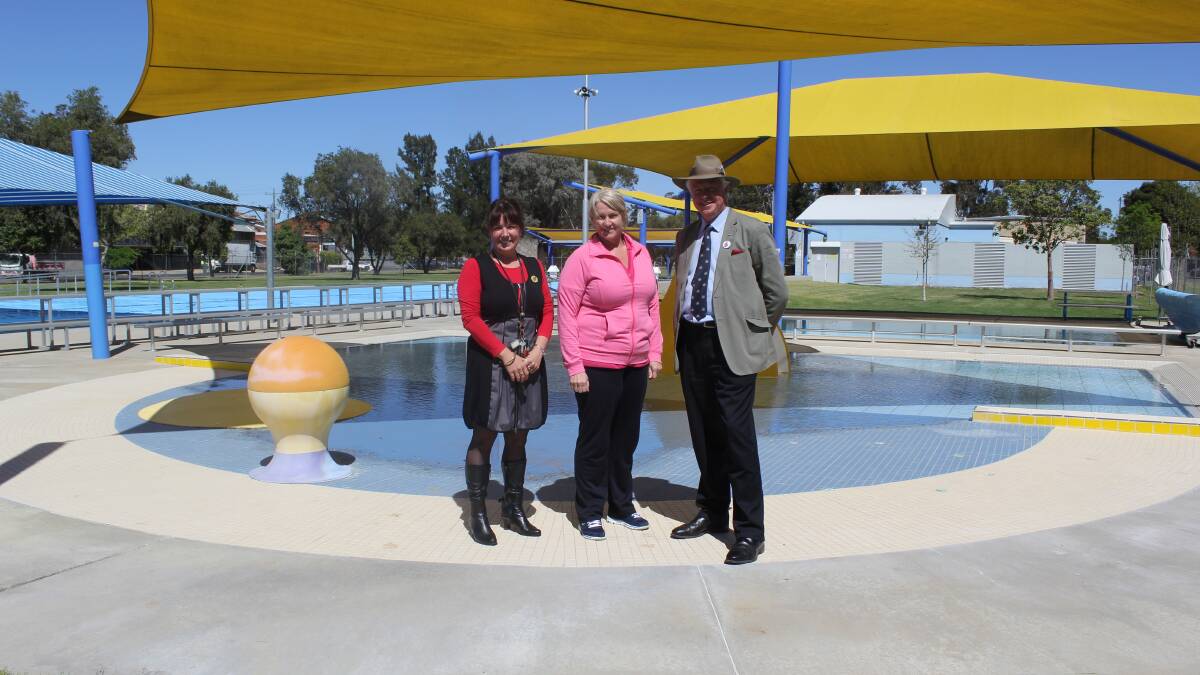 Looking forward to the opening weekend...pool manager Maree Reiher (centre) with Forbes Shire Council's Kristy Hartwig and Richard Morgan. 