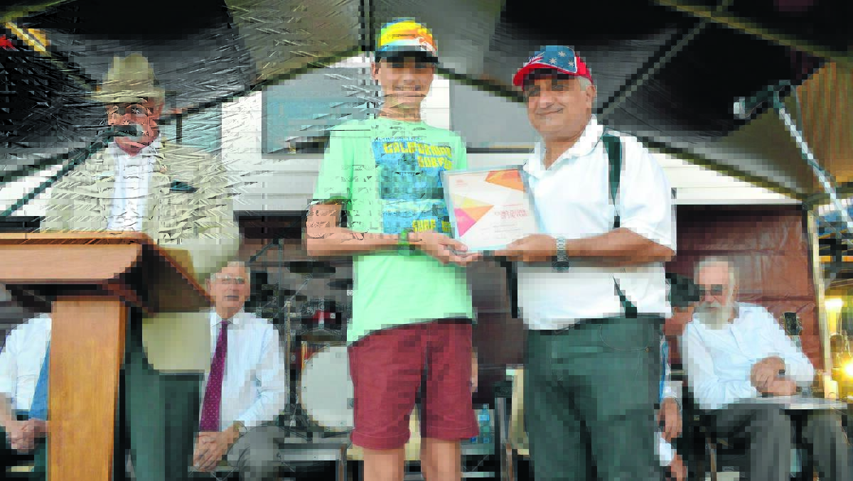 Mitchell Ashcroft is presented the Junior Citizen of the Year award by Australia Day Ambassador Andy Paschalidis. 0115dausday(65)