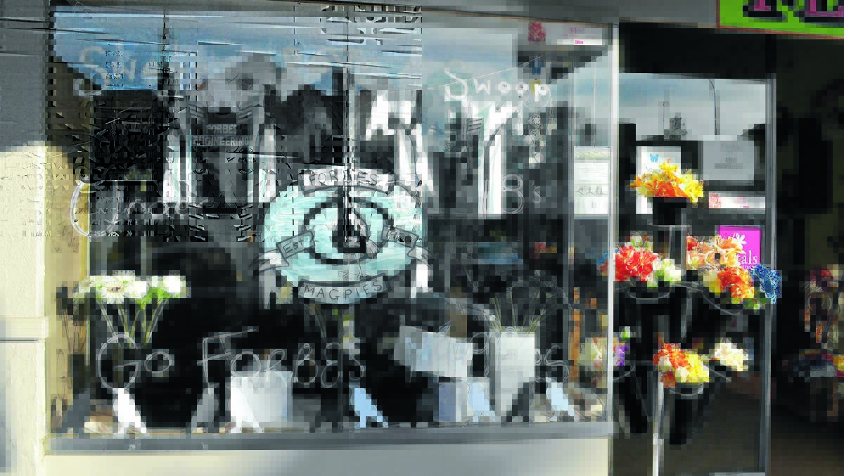 Banksia Grove Florist took out first place in the competition with their colourful Magpies-themed shopfront decoration. 