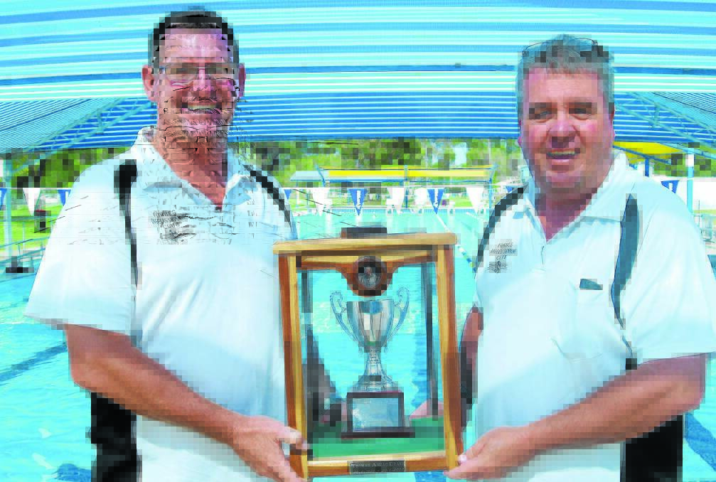 Forbes Diggers Swimming Club members Mick Prior and David Sly with the prestigious Tom Drane Memorial Trophy, which goes up for grabs on Monday. 0115diggers (3)