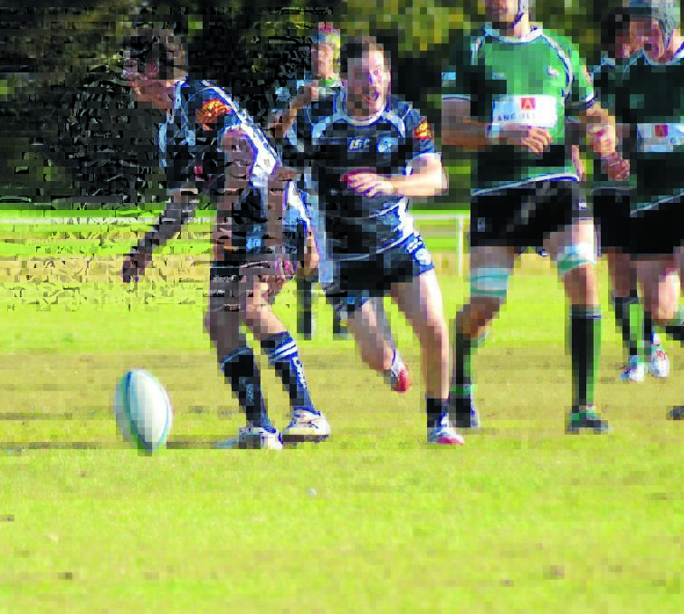 Eoin Scullion (centre) was one of the try scorers for Forbes in Saturday’s game against the Parkes Boars. 