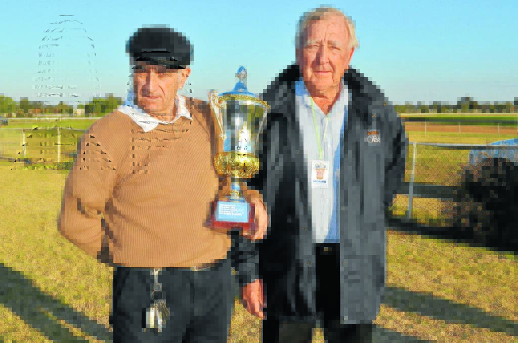 Bankstown Sports Club president John Murray (right) presented the Bankstown Sports Club Forbes Cup to Griffith trainer Gino D’Altorio after Sonro won the $25,000 feature race at Forbes Jockey Club’s TAB meeting last year.