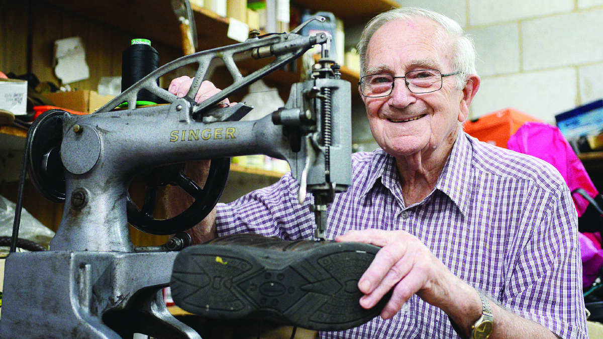 Cobbler Harry Cahill with his Singer sewing machine - still good after more than 50 years. 0215harrycahill29