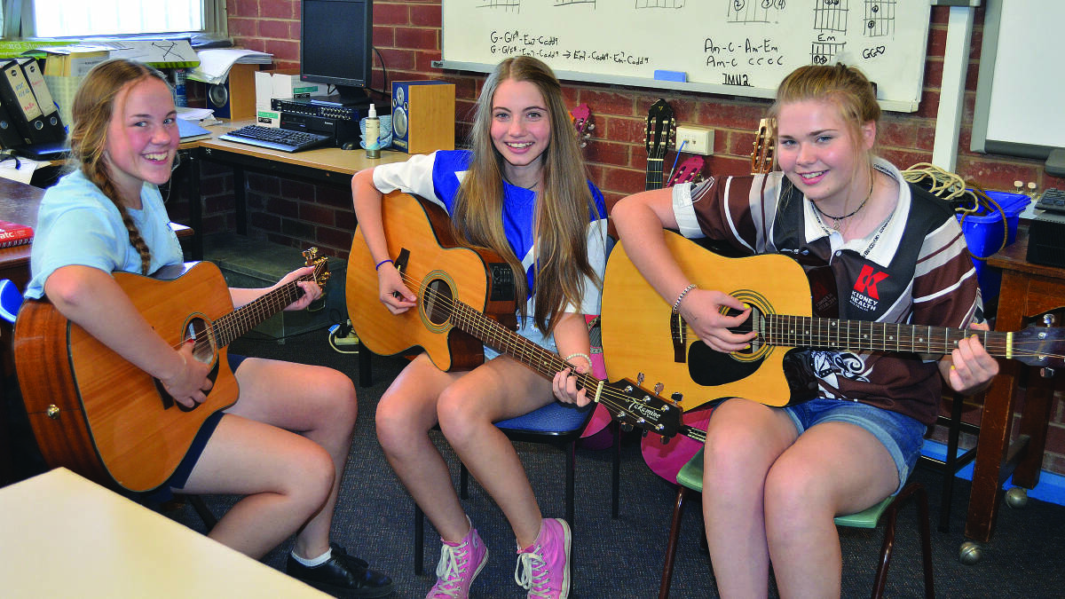 Paige Ellison, Maddison Collits and Chelsea Turner have a jam session in preparation for the M.A.D.D. Night next Friday, where they will each be performing solos. 1114maddnight(2)