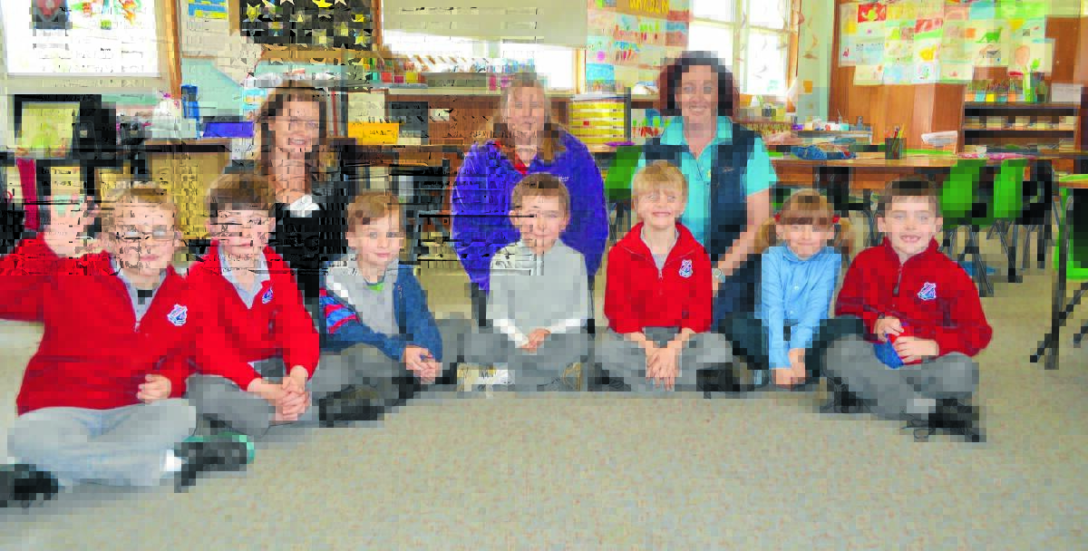 Will Holloway, Oliver Walker, Tyler Hodge, Sam Holloway, Angus Webb, Maya McLelland and Tom Greenhill were some of the students to participate in the first ethics class held at Forbes North Public School. They are pictured with primary ethics teacher De Barter, Forbes North’s P and C secretary 
Raewyn Molloy and Forbes North’s primary ethics coordinator, Tricia Greenhill.