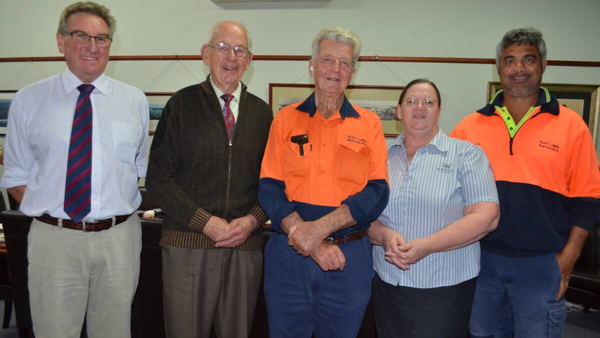 Surveyor Karl Lupis (centre) celebrates his 50 years with a morning tea hosted by McGroders Solicitors and Conveyancers’ Dennis McGroder, Ian MacCallum and Betty Trevorrow and with fellow surveyor Shayne Staines. 