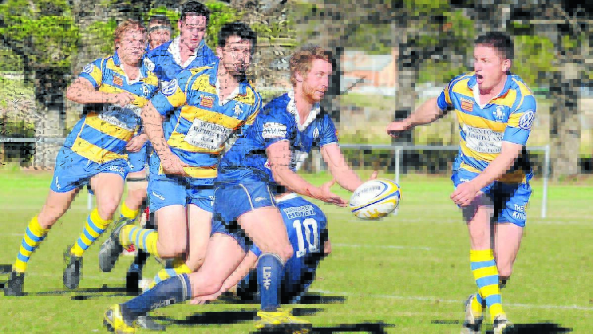 Forbes’ James Parmentier gets a pass away against Bathurst. PHOTO - Western Advocate