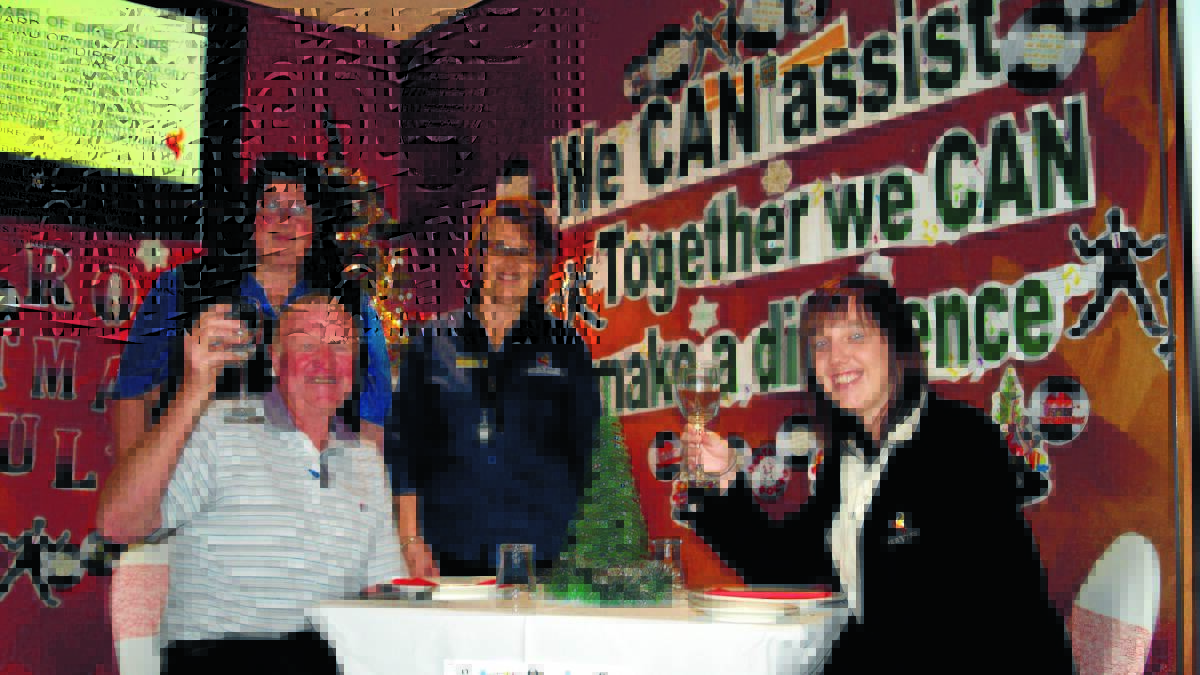 Forbes Services Memorial Club staff Lindy Sherritt and Rayleen Paradowski serve up some Christmas cheer to CanAssist president Kerry Dunstan and the club’s function and events manager Jackie Lord, ahead of this Saturday’s Christmas in July event. 