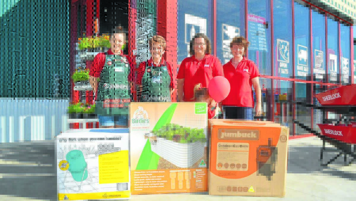 Bunnings team members April Townsend and Gill Taylor hand over a pizza oven, compost turner and raised veggie bed to Forbes Food Revolution ambassador Lucy Pearce, little helper Isabel Pearce and team member Maree Yapp to be used for the Forbes Food Revolution Day on Saturday, May 16. 0315bunningsdonation(2)