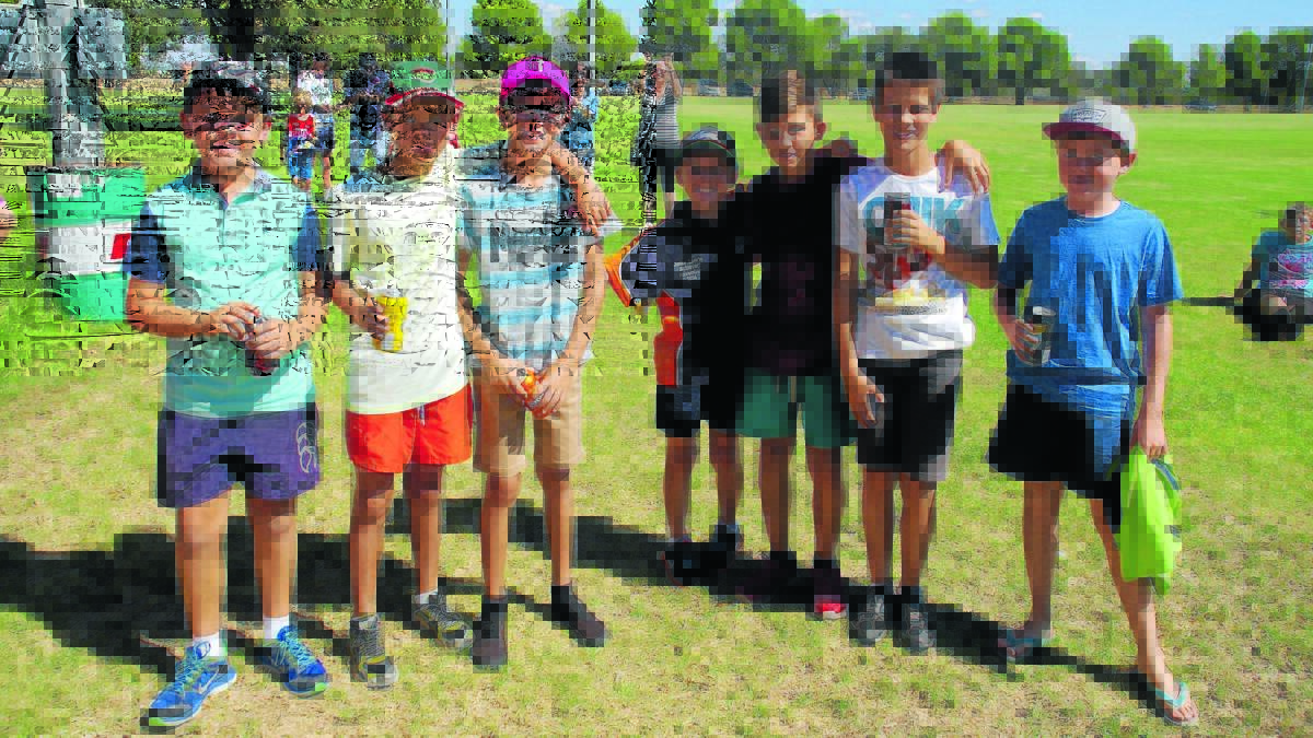 Junior cricketers cooled off at the presentation at the end of the 2014 cricket season. 0315jrcrickpres(5)